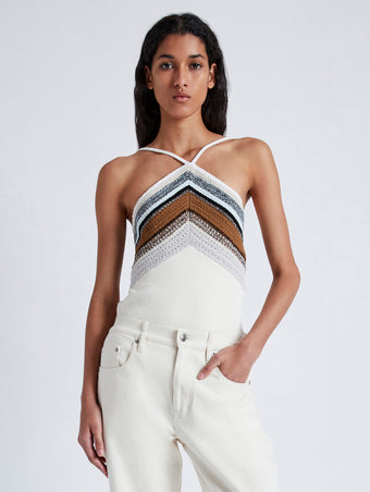 Cropped front image of model wearing Bella Tank in Crochet Stripe Knit in white multi