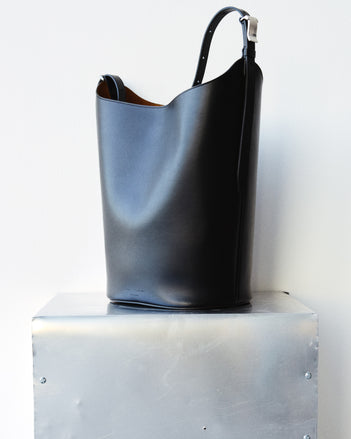 Brant Bucket Bag in Smooth Calf in black on silver platform