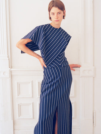 Model wearing Selene Dress in Bi-Stretch Plaid Suiting in cobalt multi