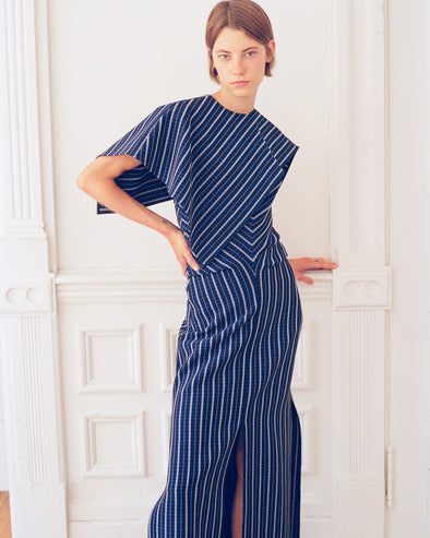 Model wearing Selene Dress in Bi-Stretch Plaid Suiting in cobalt multi