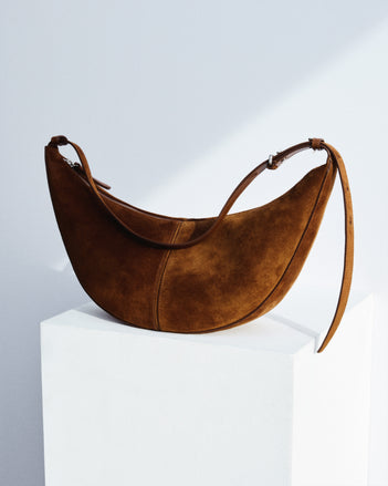 Slide Bag in Suede in saddle on white platform