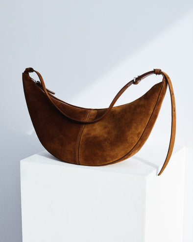 Slide Bag in Suede in saddle on white platform