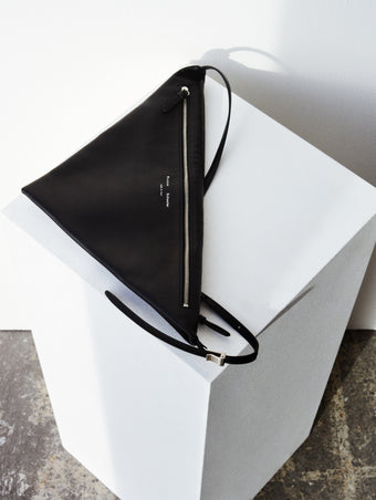 Aerial image of Tetra Shoulder Bag in Nappa in black on white platform