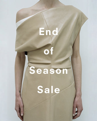 Cropped image of model wearing Rosa Dress in Smooth Leather in light khaki, 'End of Season Sale' overlaid