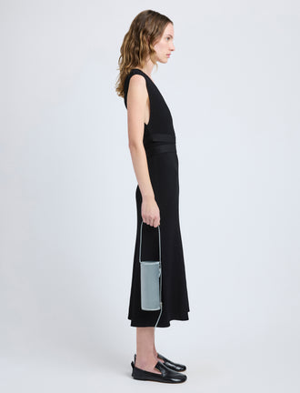 Proenza Schouler image of model carrying Silo Bag in Satin in smoke