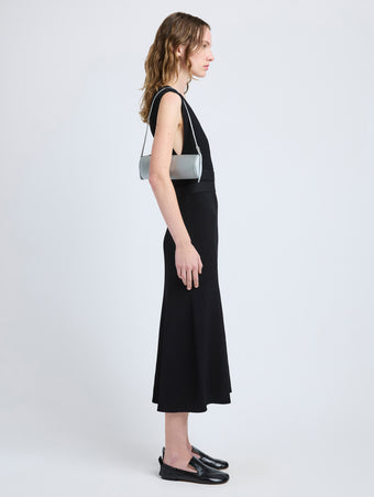 Proenza Schouler image of model carrying Silo Bag in Satin in smoke