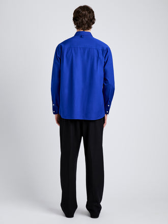 Proenza Schouler Back full length image of model wearing Simon Shirt in Poplin in Cobalt Blue