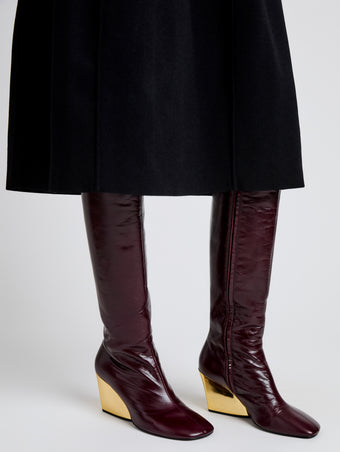 Proenza Schouler Detail image of Slant Boots in Slick Calf in Currant