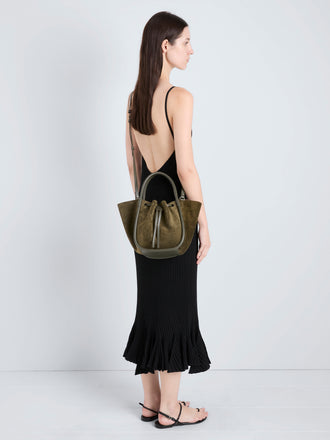 Proenza Schouler Image of model holding Small Ruched Tote in Soft Suede in Olive