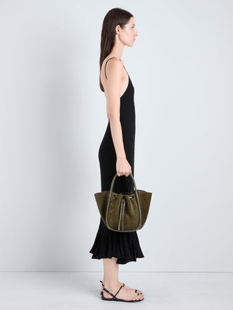 Proenza Schouler Image of model holding Small Ruched Tote in Soft Suede in Olive