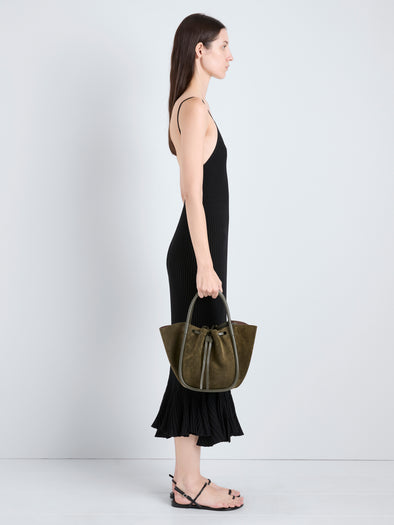 Proenza Schouler Image of model holding Small Ruched Tote in Soft Suede in Olive