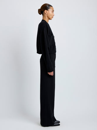 Proenza Schouler Full length side image of model wearing Sofia Cardigan in Eco Cashmere in black