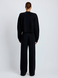Proenza Schouler Full length back image of model wearing Sofia Cardigan in Eco Cashmere in black