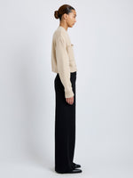 Side full length image of model wearing Sofia Cardigan In Eco Cashmere in Oatmeal