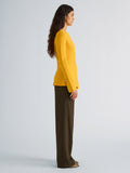 Proenza Schouler Side full length image of model wearing Sukki Jacket in Draped Viscose in Marigold