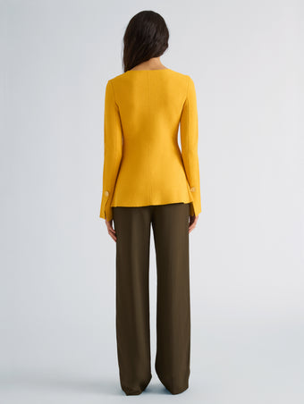 Proenza Schouler Back full length image of model wearing Sukki Jacket in Draped Viscose in Marigold