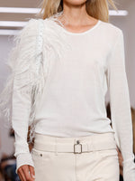 Runway image of Park Shoulder Bag In Nylon With Feathers in optic white