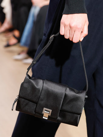 Runway image of Flip Shoulder Bag in Satin in black
