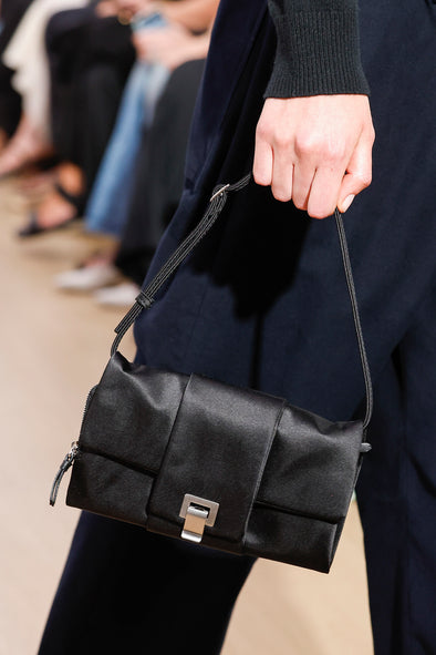 Runway image of Flip Shoulder Bag in Satin in black