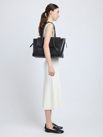 Image of model carrying Tate Bag in Smooth Calfskin in BLACK
