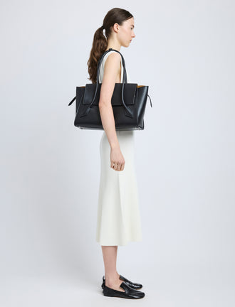 Image of model carrying Tate Bag in Smooth Calfskin in BLACK