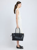 Image of model carrying Tate Bag in Smooth Calfskin in BLACK