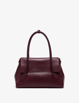 Front image of Tate Bag in Smooth Calfskin in dark red with sides tucked