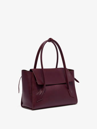 Side image of Tate Bag in Smooth Calfskin in dark red