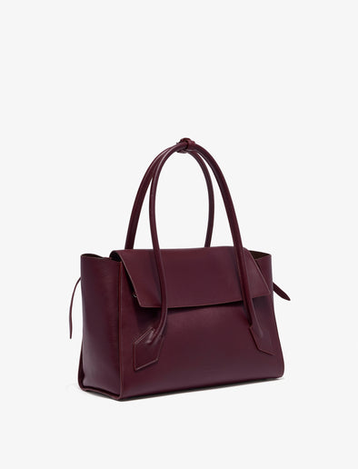 Side image of Tate Bag in Smooth Calfskin in dark red