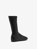 Proenza Schouler Back 3/4 image of Tee Sock Boots in Faux Leather in black