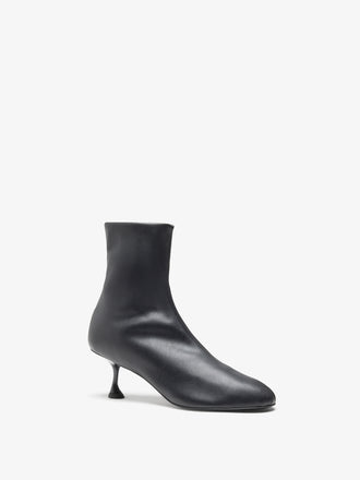 Proenza Schouler front 3/4 image of Tee Stretch Booties in Black