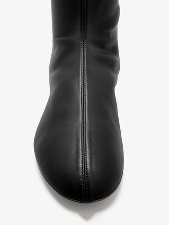 Proenza Schouler Aerial image of Tee Stretch Flat Boots in Black