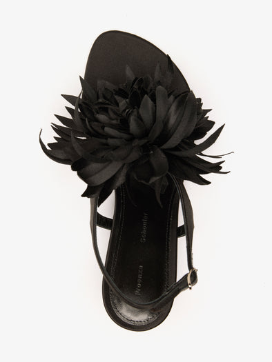 Proenza Schouler Still Life Aerial Image of Tee Thong Flower Sandals in Satin in Black