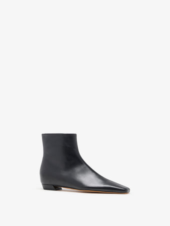 3/4 Front image of Trap Flat Ankle Boots In Nappa Leather in Black