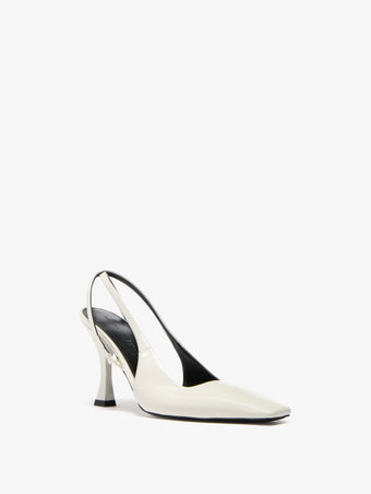 Proenza Schouler front 3/4 image of Trap Cross Slingback Pumps in Spazzolato Leather in ecru
