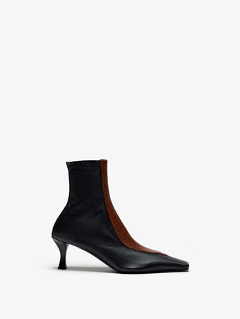 Proenza Schouler Still Life image of Front View of Trap Stretch Ankle Boot 60MM Lizard Combo in Black/Cuoio Combo
