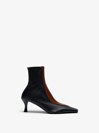 Proenza Schouler Still Life image of Front View of Trap Stretch Ankle Boot 60MM Lizard Combo in Black/Cuoio Combo