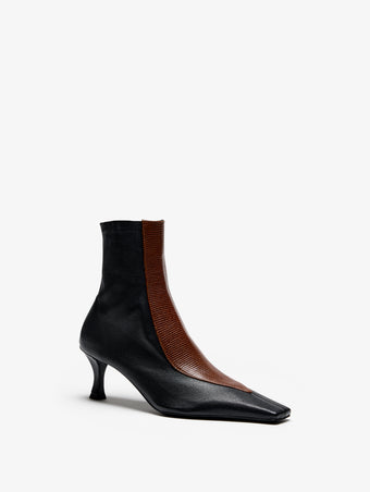 Proenza Schouler Still Life Image of Side View of Trap Stretch Ankle Boot 60MM Lizard Combo in Black/Cuoio Combo