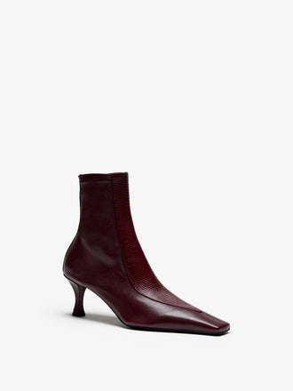 Proenza Schouler Still Life Image of Side View of Trap Stretch Ankle Boot 60MM Lizard Combo in Oxblood