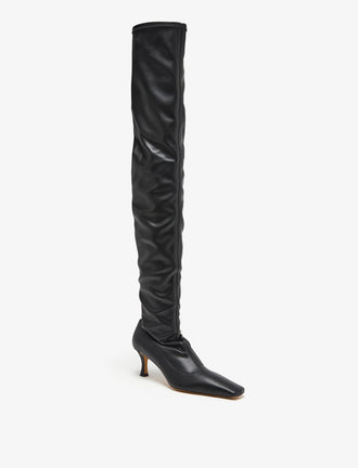 Proenza Schouler front 3/4 image of Trap Over The Knee Boots - 60MM in black