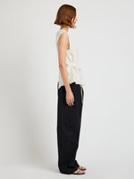 Proenza Schouler Side full length image of model wearing the Trina Top in Woven Stripe Flou in Chalk Black 