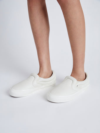 Image of model wearing Vans x Proenza Schouler Puffy Slip-On Shoes in ecru