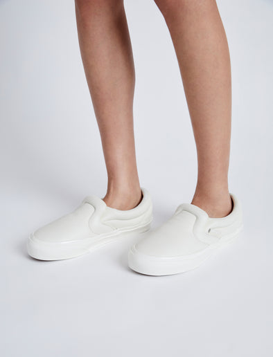 Image of model wearing Vans x Proenza Schouler Puffy Slip-On Shoes in ecru