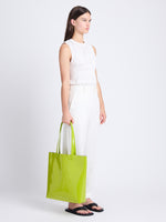 Image of model wearing Walker Tote in CHARTREUSE