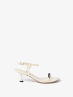 Side image of the Tee Toe Ring Sandals in cream/black