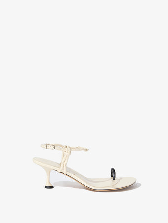 Side image of the Tee Toe Ring Sandals in cream/black