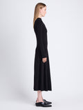 Side image of model wearing Isabella Dress in Brushed Rib in black