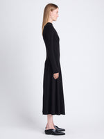 Side image of model wearing Isabella Dress in Brushed Rib in black