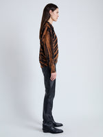 Side image of model wearing Blake Sweatshirt in BLACK/RUST