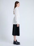 Side image of model wearing Senna Top in Poplin in off white